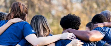 masthead friends linking arms in unity